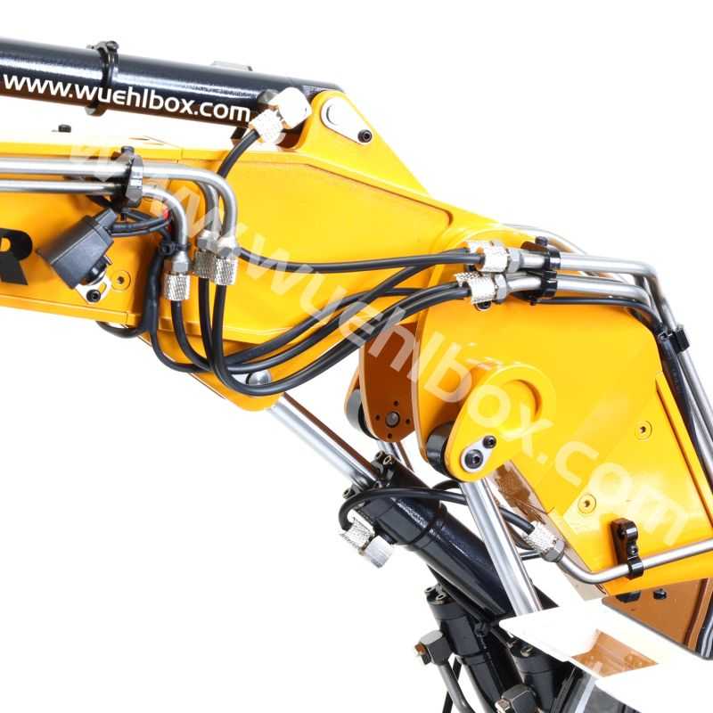 Yellow hydraulic excavator arm of an excavator on a construction